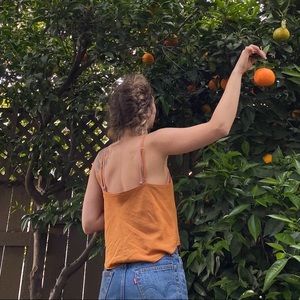 Super cute camisole/tank with double layer in front. Size S/M